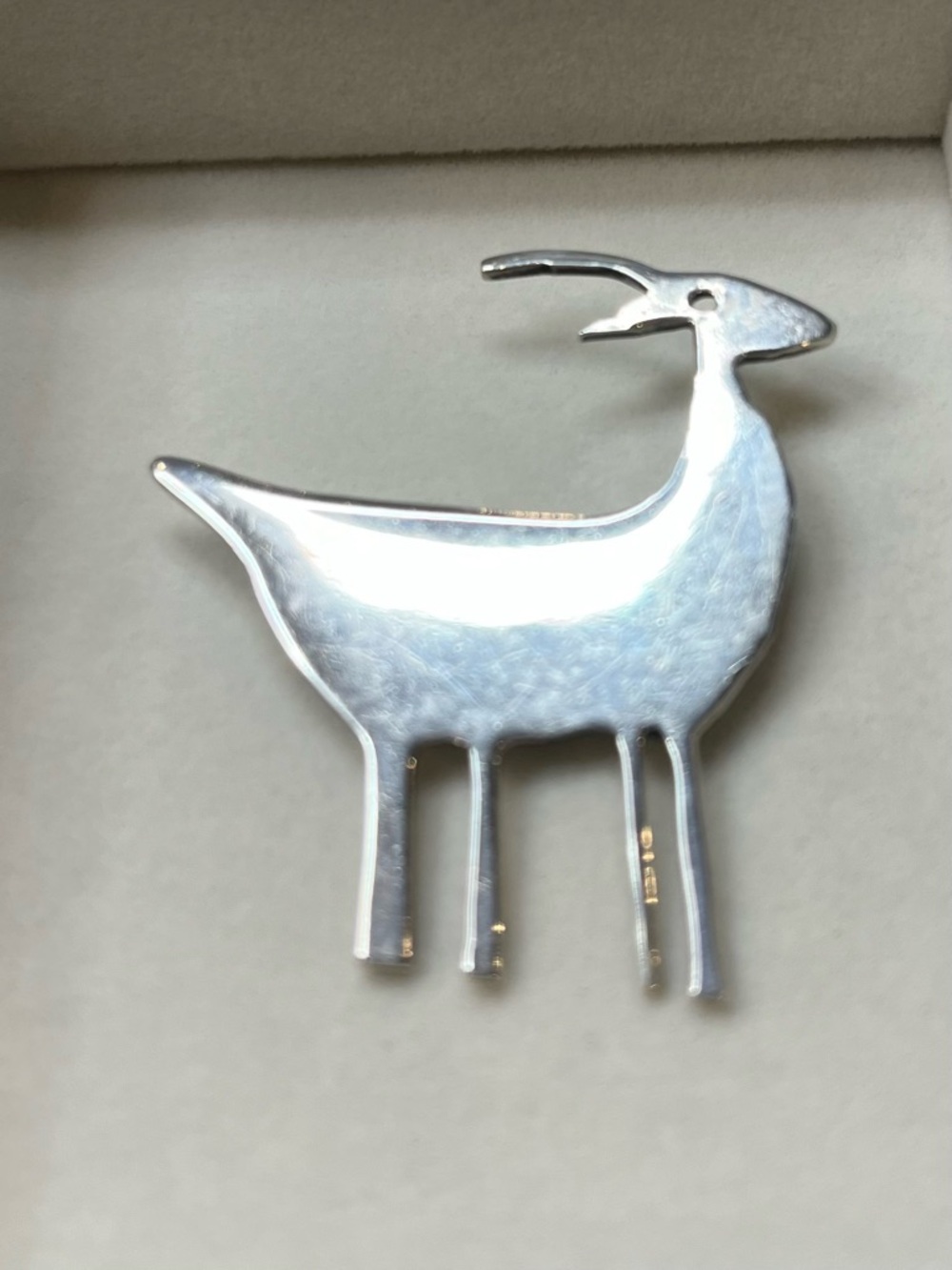 Sterling Silver Deer Brooch with sleek minimalist lines for versatile styling.